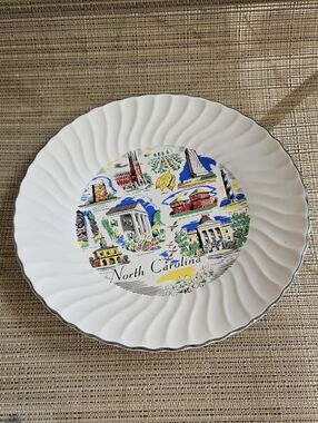 Vintage Souvenir collector's plate featuring iconic North Carolina landmarks